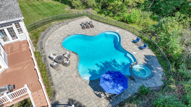 view of pool with an in ground hot tub and a patio