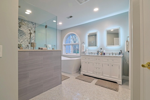 bathroom featuring tile patterned floors, vanity, separate shower and tub, and tile walls