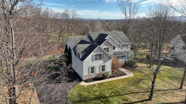 view of side of home featuring a yard