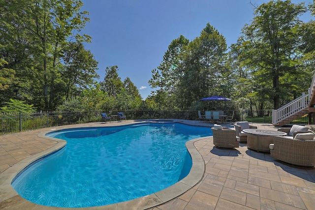 view of pool featuring a patio area