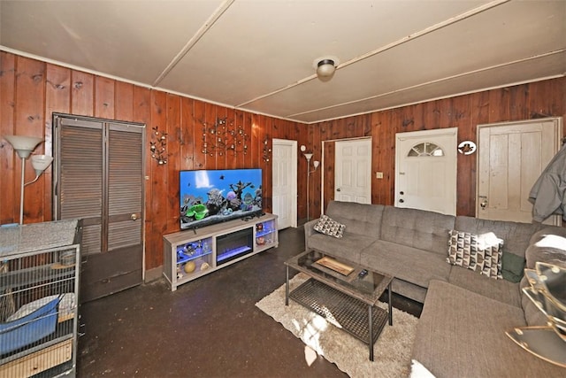 living room featuring wood walls