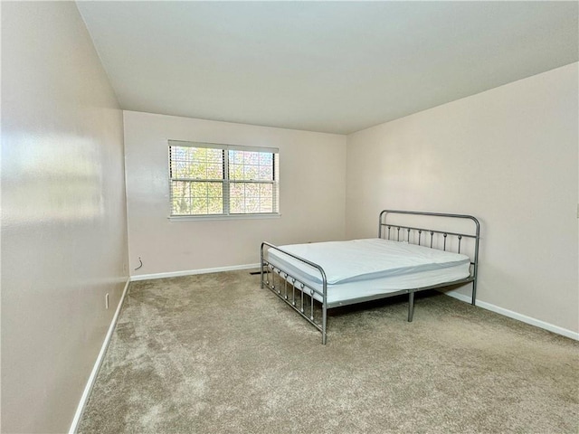 bedroom featuring light carpet