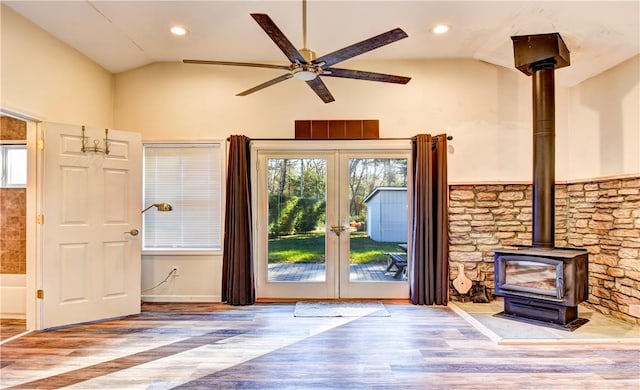 entryway with hardwood / wood-style floors, vaulted ceiling, and french doors