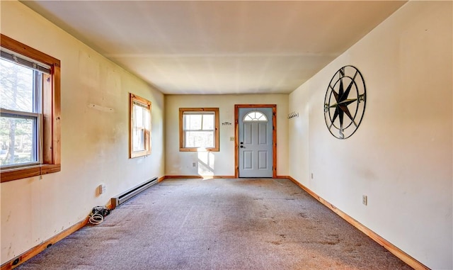 carpeted entryway with plenty of natural light and a baseboard radiator