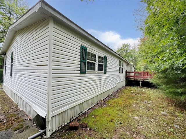 view of property exterior featuring a deck