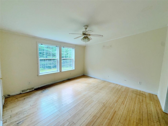 spare room featuring ceiling fan and light wood-type flooring