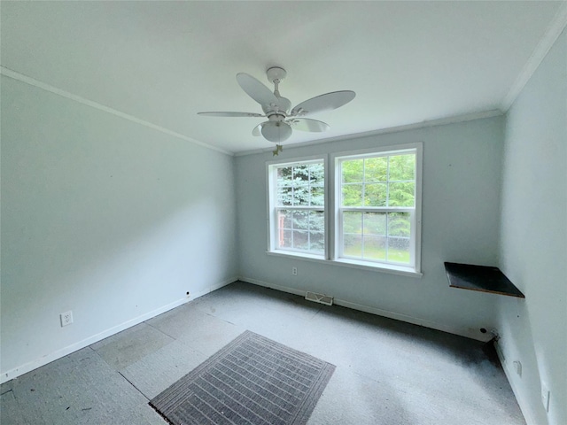 unfurnished room featuring ceiling fan and ornamental molding