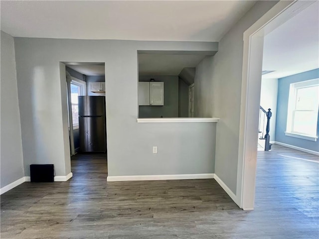 corridor featuring hardwood / wood-style floors