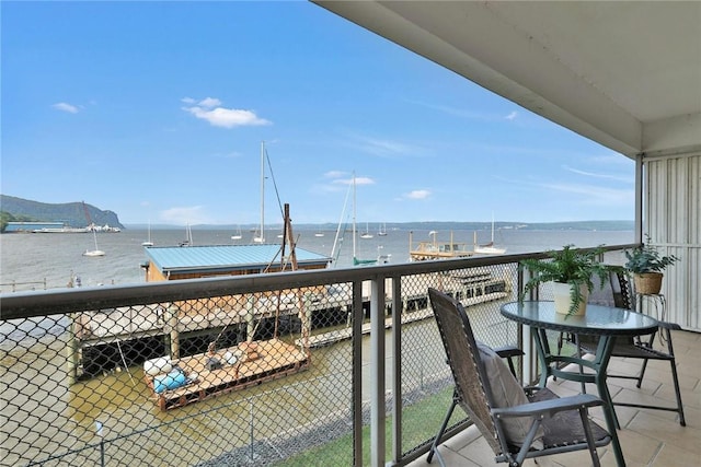 balcony featuring a water view