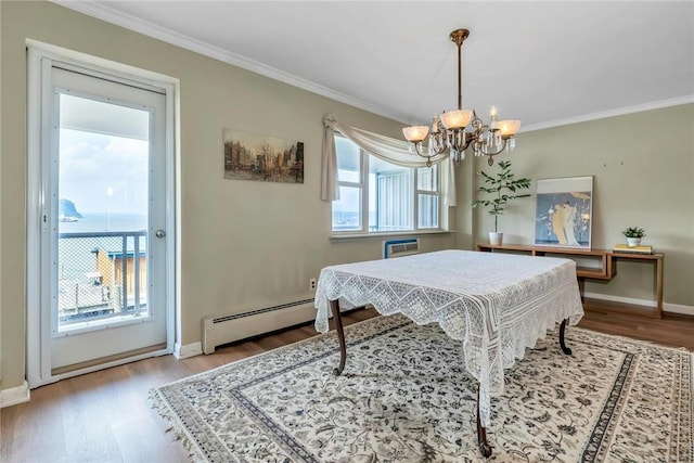 playroom featuring crown molding, light hardwood / wood-style flooring, a baseboard radiator, and an inviting chandelier