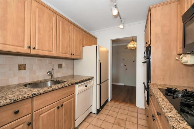 kitchen with black appliances, crown molding, sink, light stone countertops, and light tile patterned flooring