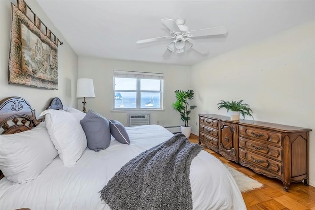 bedroom featuring an AC wall unit, ceiling fan, light parquet floors, and a baseboard radiator