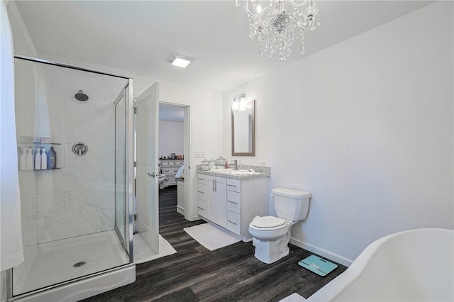 full bathroom with vanity, separate shower and tub, wood-type flooring, a notable chandelier, and toilet