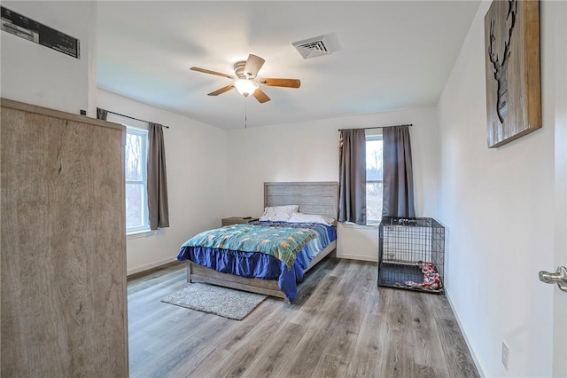 bedroom featuring wood-type flooring and ceiling fan