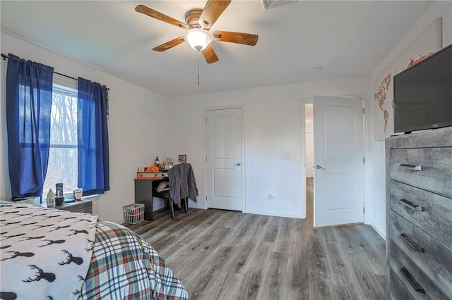 unfurnished bedroom with light hardwood / wood-style flooring and ceiling fan