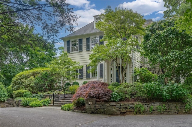 view of front of home with stairs