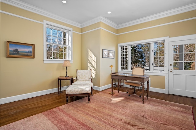 sitting room with baseboards, ornamental molding, and wood finished floors