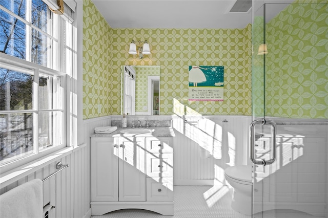 interior space featuring toilet, a wainscoted wall, vanity, visible vents, and wallpapered walls