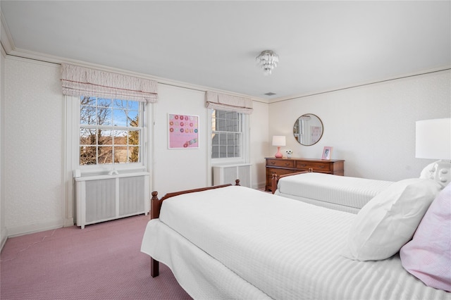 carpeted bedroom featuring baseboards, radiator heating unit, visible vents, and crown molding