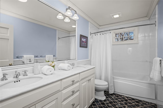 full bath with double vanity, a sink, toilet, and crown molding