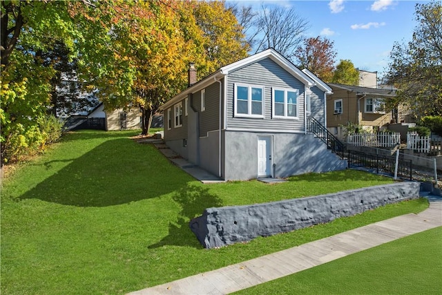 view of home's exterior with a lawn