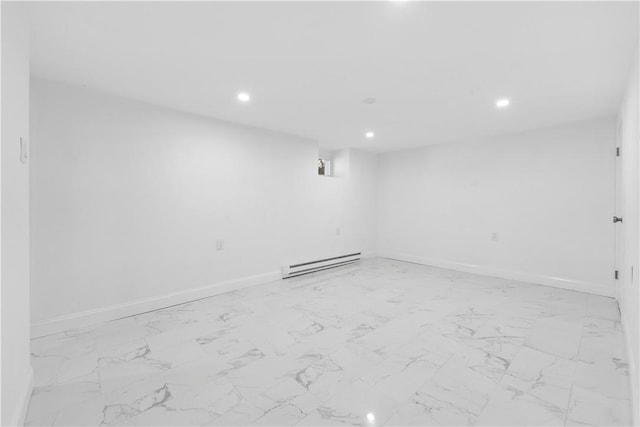 unfurnished room featuring a baseboard heating unit