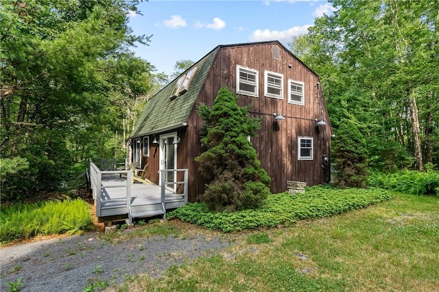 view of side of home featuring a wooden deck