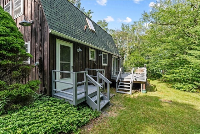 back of house with a yard and a deck