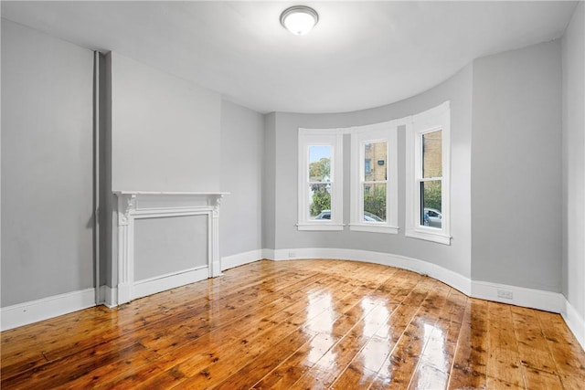 unfurnished living room with hardwood / wood-style floors