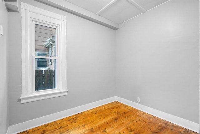 unfurnished room featuring wood-type flooring