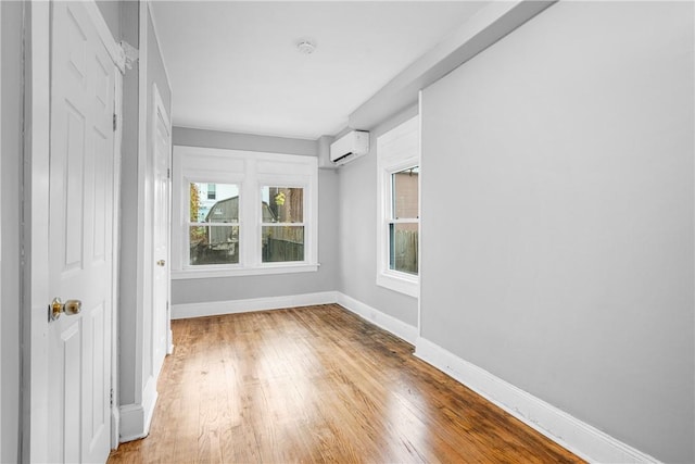 unfurnished sunroom featuring a wall mounted air conditioner