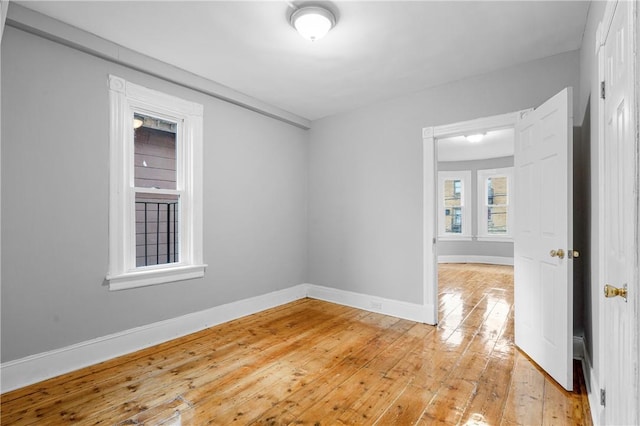 spare room featuring light hardwood / wood-style floors