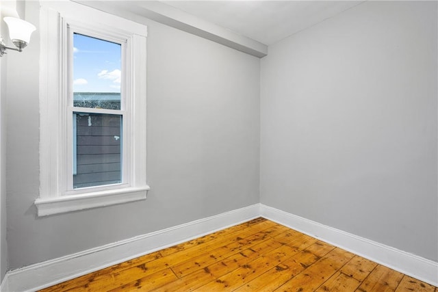 unfurnished room featuring hardwood / wood-style floors