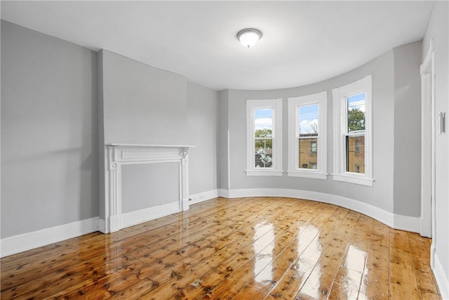 unfurnished living room featuring wood-type flooring