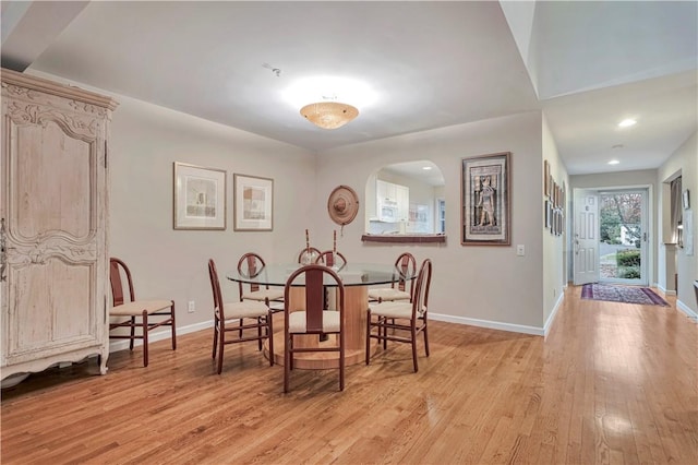 dining space featuring light wood-type flooring