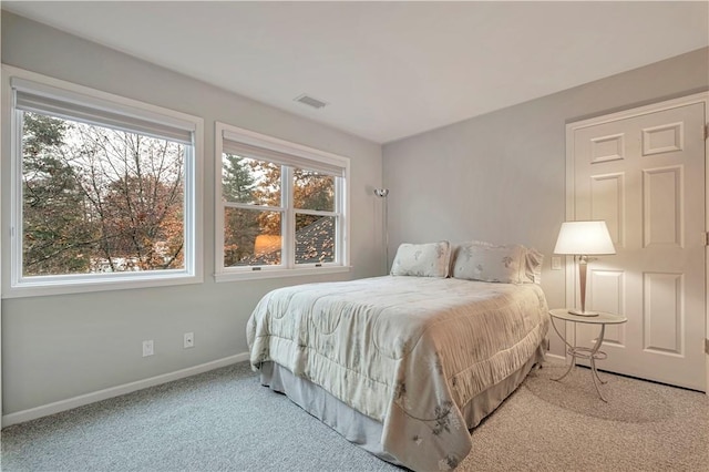 bedroom with light colored carpet