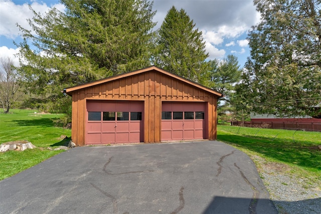 garage with a yard