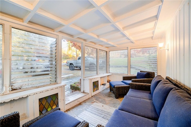 sunroom featuring a wealth of natural light and coffered ceiling