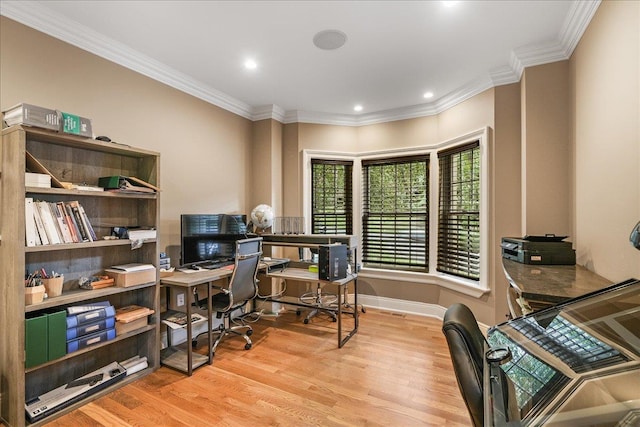 office area with light wood-type flooring and ornamental molding