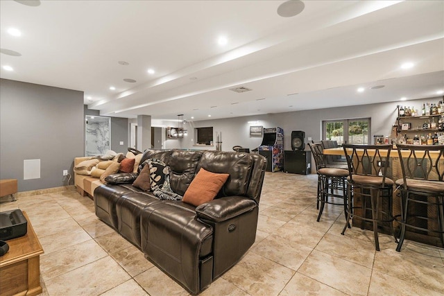 tiled home theater featuring bar