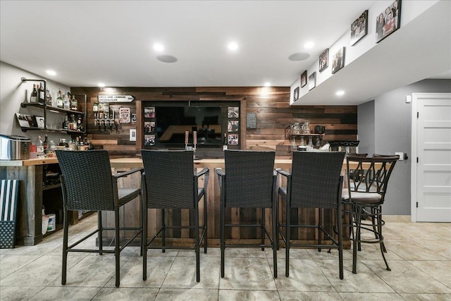 bar featuring wooden walls