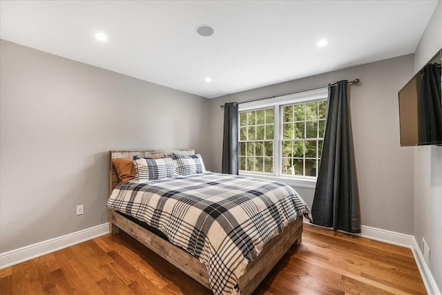 bedroom featuring wood-type flooring