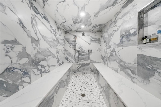 bathroom featuring a tile shower