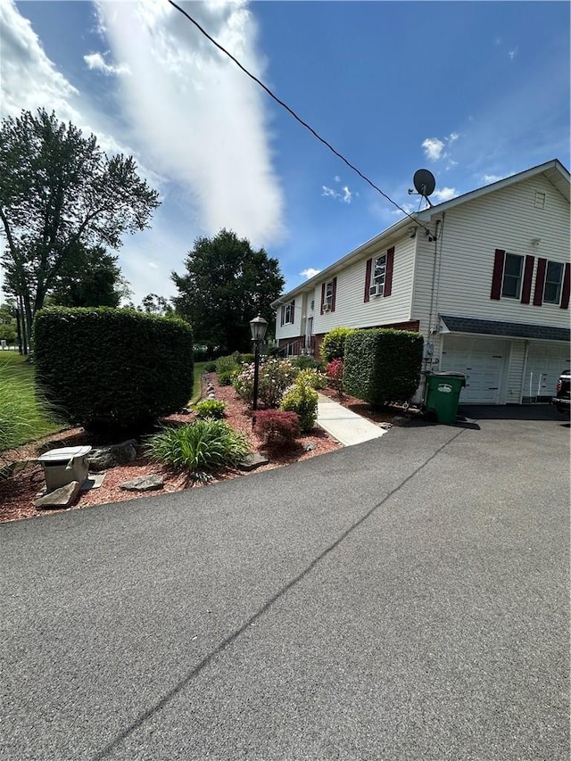 view of side of home featuring a garage