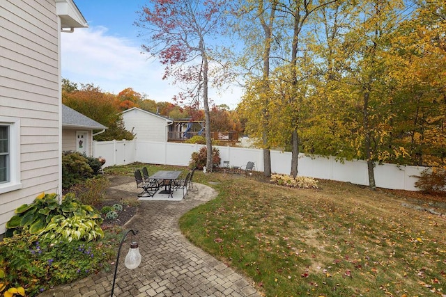 view of yard with a patio and a fenced backyard