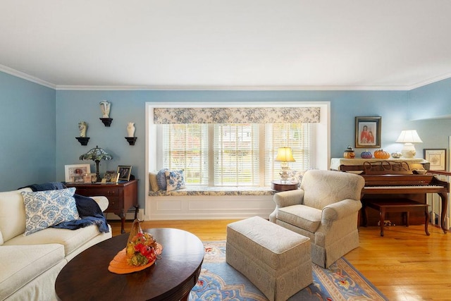 living area featuring wood finished floors and ornamental molding