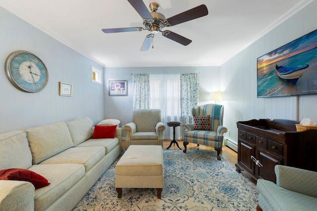 living area with a baseboard radiator, a ceiling fan, wood finished floors, and crown molding