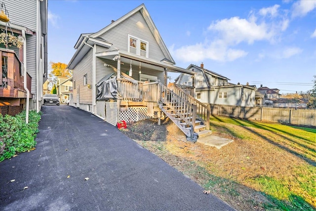 view of front of property with a wooden deck