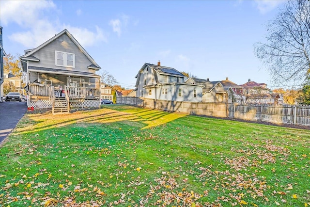 view of yard with a wooden deck