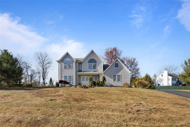 front facade with a front yard